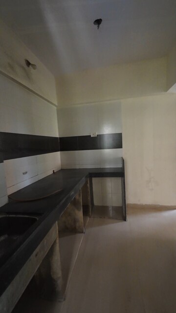 Kitchen in 2 BHK Apartment at Ravi Gaurav Aster, Mira Road – for Rent