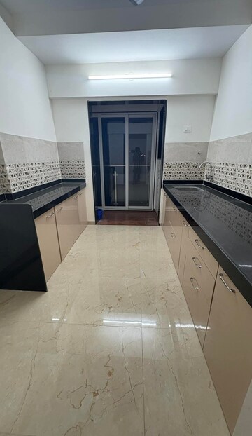 Kitchen in 2 BHK Apartment at Mahavir Square, Manpada – for Rent
