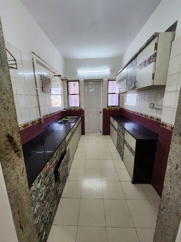 Kitchen in 2.5 BHK Apartment at NRI Complex Phase 2, Seawoods – for Rent