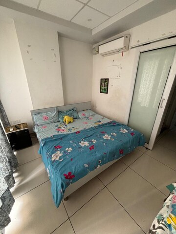 Bedroom in 1 BHK Apartment at Paradigm Business Hermitage Park, Dhakoli Village – for Rent
