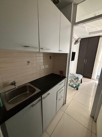 Kitchen in 1 BHK Apartment at Paradigm Business Hermitage Park, Dhakoli Village – for Rent