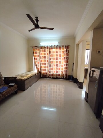 Living Room in 1 BHK Apartment at Royal Palms Garden View, Goregaon East – for Sale