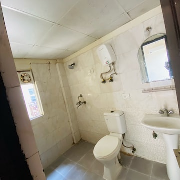 Bathroom in 3 BHK Apartment at Aims Golf City, Noida Central – for Rent