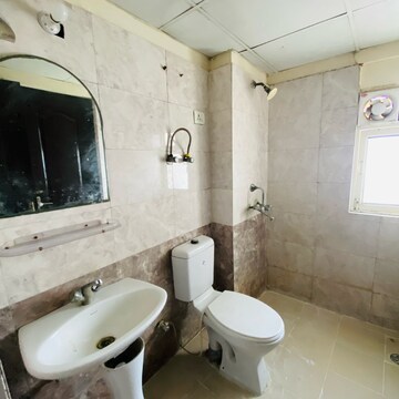 Bathroom in 3 BHK Apartment at Aims Golf City, Noida Central – for Rent