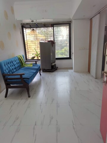 Living Room in Studio Apartment at Royal Palms Garden View, Goregaon East – for Rent