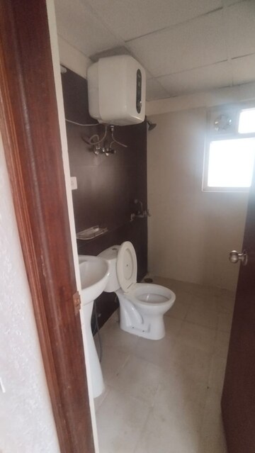 Bathroom in 2 BHK Apartment at Aims Golf City, Sector 75 – for Rent