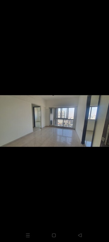 Living Room in 1 BHK Apartment at Omkar Signet, Malad East – for Rent