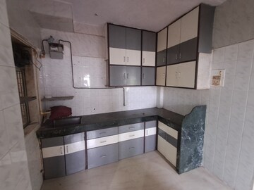 Kitchen in 1 BHK Apartment at Shantinagar CHS, Mira Road – for Sale