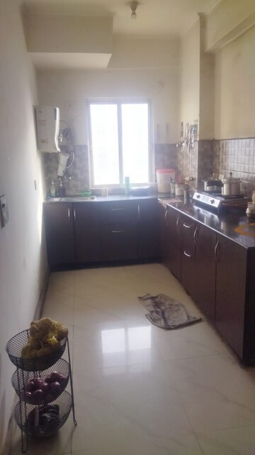 Kitchen in 2.5 BHK Apartment at Aims Golf City, Sector 75 – for Sale