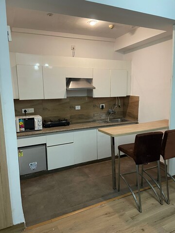 Kitchen in 1 RK Apartment at Nimbus The Golden Palm, Sector 168 – for Rent