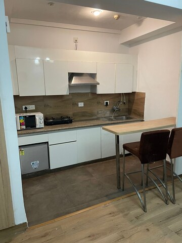 Kitchen in 1 RK Apartment at Nimbus The Golden Palm, Sector 168 – for Rent