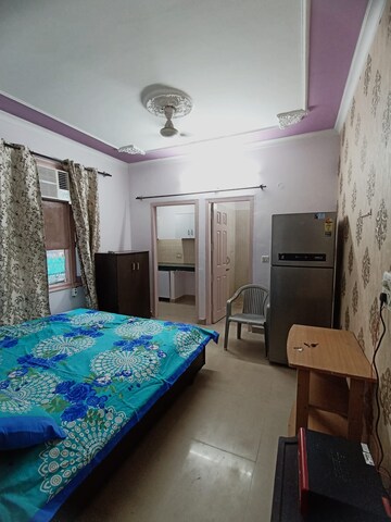 Bedroom in 1 RK Apartment at Hanumant Bollywood Heights, Dhakoli Village – for Rent