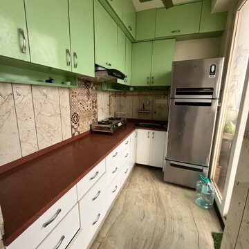 Kitchen in 2.5 BHK Apartment at Raj Nagar Extension – for Rent