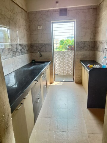 Kitchen in 1 BHK Apartment at K K Crystal Park, Palghar – for Sale