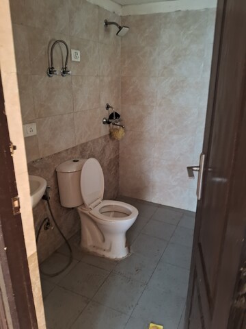 Bathroom in 2.5 BHK Apartment at Aims Golf City, Sector 75 – for Rent