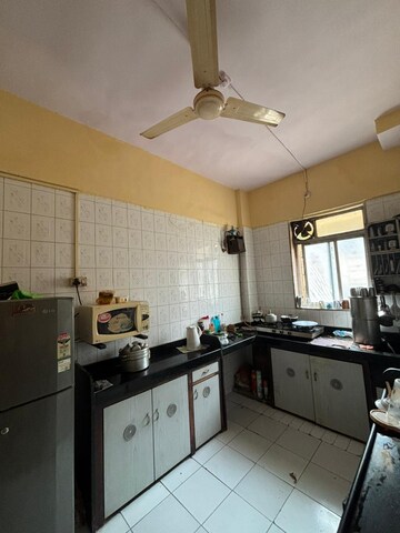 Kitchen in 2 BHK Apartment at Veda CHS, Dahisar West – for Sale