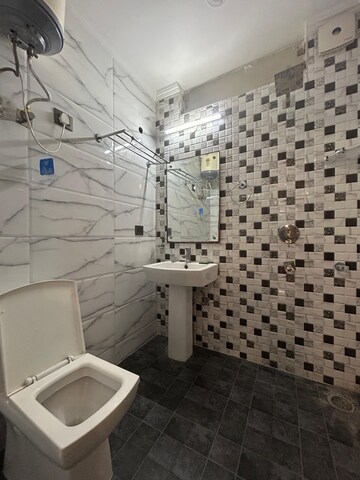 Bathroom in 3 BHK Apartment at Freedom Fighters Enclave – for Rent