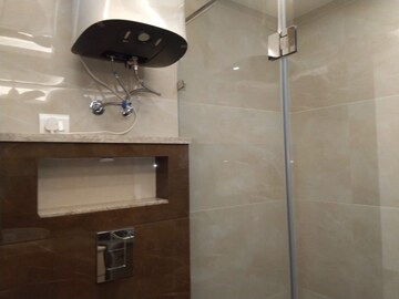 Bathroom in 4 BHK Apartment at Sarvodya Enclave – for Rent