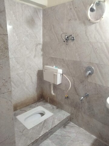Bathroom in 2 BHK Apartment at Kuber Varshatai Tower, Kurla – for Rent