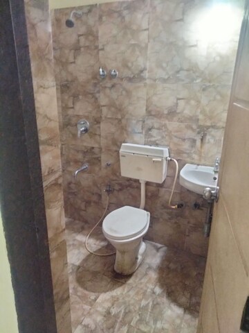 Bathroom in 2 BHK Apartment at Kuber Varshatai Tower, Kurla – for Rent