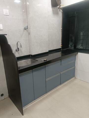 Kitchen in 1 BHK Apartment at Achal Avichal Chanchal CHS, Andheri West – for Sale