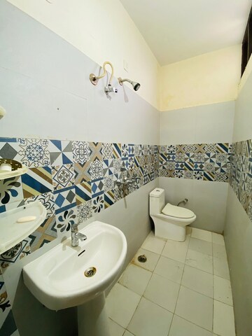 Bathroom in 2 BHK Apartment at Sunny Enclave – for Rent