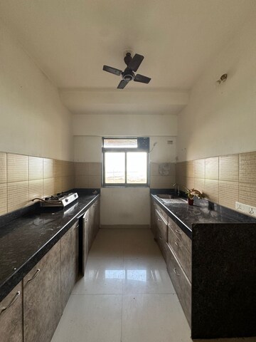 Kitchen in 2 BHK Apartment at Acme Ozone, Manpada – for Rent