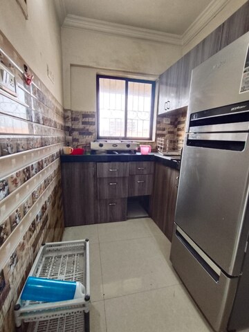 Kitchen in 1 BHK Apartment at Royal Palms, Goregaon East – for Rent