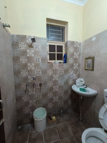 Bathroom in 1 BHK Builder Floor at Dhakoli Village – for Sale