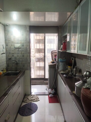 Kitchen in 1 BHK Apartment at Ravi Gaurav Excellency, Mira Road – for Sale