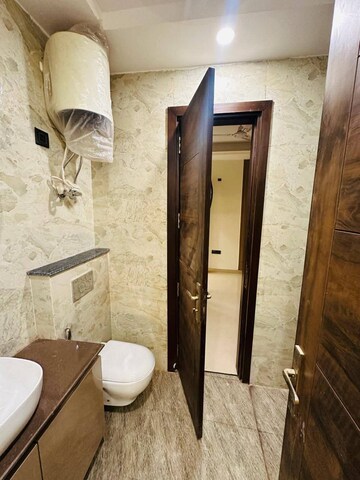 Bathroom in 3 BHK Apartment at Rohini Sector 9 – for Rent