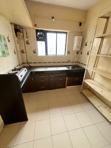 Kitchen in 2 BHK Apartment at Kailash CHS, Kothrud – for Rent