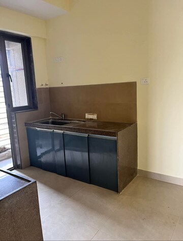 Kitchen in 2.5 BHK Apartment at Bhimjyani Verraton, Manpada – for Rent
