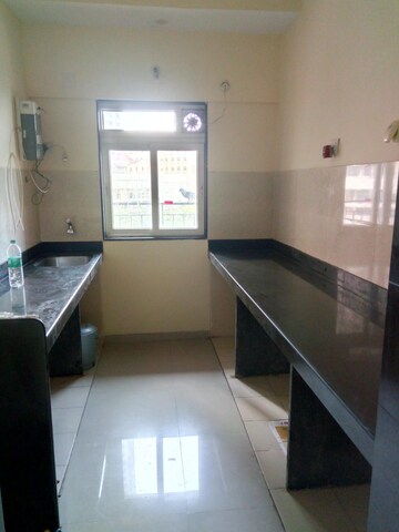 Kitchen in 2 BHK Apartment at Rustomjee Urbania Acura, Majiwada – for Sale