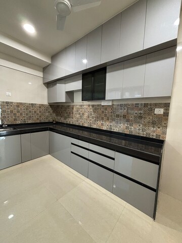 Kitchen in 4 BHK Apartment at Rajesh Raj Infinia, Malad West – for Rent