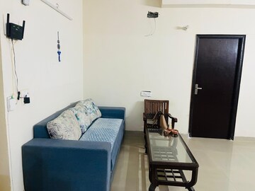 Living Room in 2.5 BHK Apartment at Aims Golf City, Sector 75 – for Rent