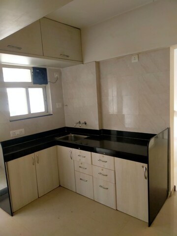 Kitchen in 1 BHK Apartment at Sancheti Eves Garden, Mundhwa – for Sale