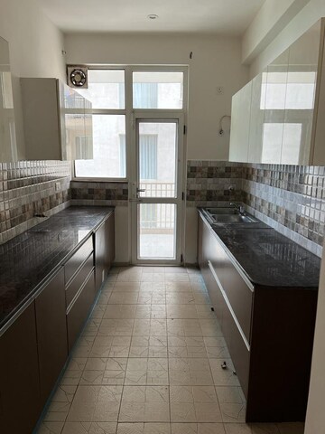 Kitchen in 3 BHK Apartment at Sushma Crescent, Dhakoli Village – for Rent