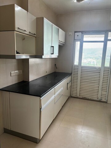 Kitchen in 3 BHK Apartment at Lokhandwala Whispering Palms XXclusives, Kandivali East – for Rent