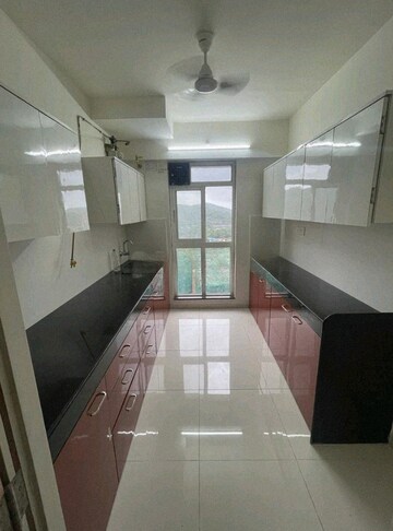 Kitchen in 3 BHK Apartment at Godrej Emerald, Ghodbunder Road – for Rent