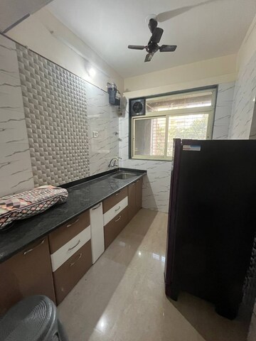 Kitchen in 2 BHK Apartment at Mohan Willows, Badlapur East – for Rent