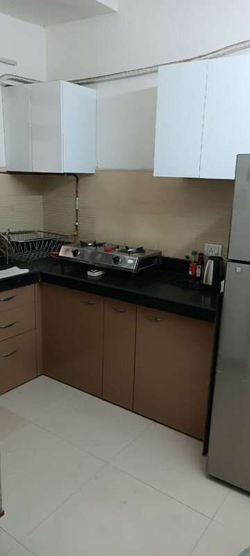 Kitchen in 1 BHK Apartment at RDC Woods Teakwoods, Ghodbunder Road – for Rent