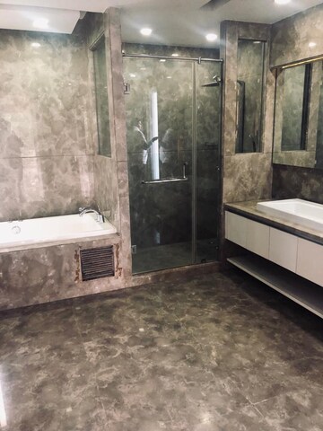 Bathroom in 4 BHK Apartment at Vasant Vihar – for Sale