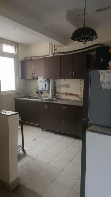 Kitchen in 2 BHK Apartment at Amrapali Silicon City, Sector 76 – for Rent
