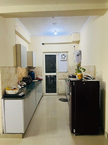 Kitchen in 2.5 BHK Apartment at Aims Golf City, Sector 75 – for Sale