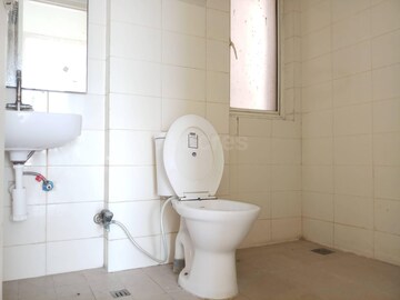 Bathroom in 2 BHK Apartment at Shiv Sai Ozone Park, Sector 86 – for Rent