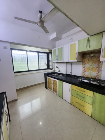 Kitchen in 3 BHK Apartment at Soham Garden, Manpada – for Sale