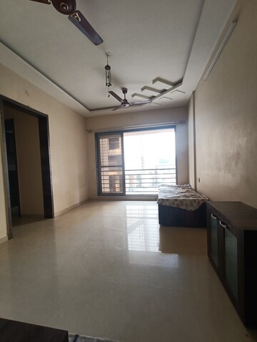 Living Room in 1 BHK Apartment at Salasar Aangan, Mira Road – for Rent
