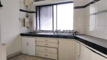 Kitchen in 2 BHK Apartment at Raheja Gardens, Netaji Nagar – for Rent