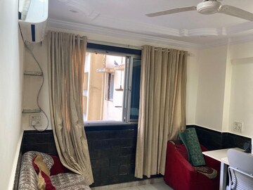 Living Room in 1 BHK Apartment at Hiranandani Garden Blue Bell, Powai – for Rent